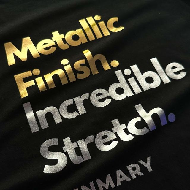 Black T-shirt with gold and silver metallic lettering