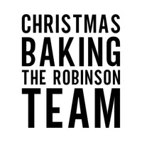 Christmas Baking Team iron-on design: black CHRISTMAS BAKING THE ROBINSON TEAM lettering on white