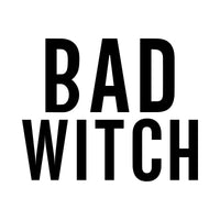 Bold black capitals reading BAD WITCH stacked on two lines, iron-on design on white