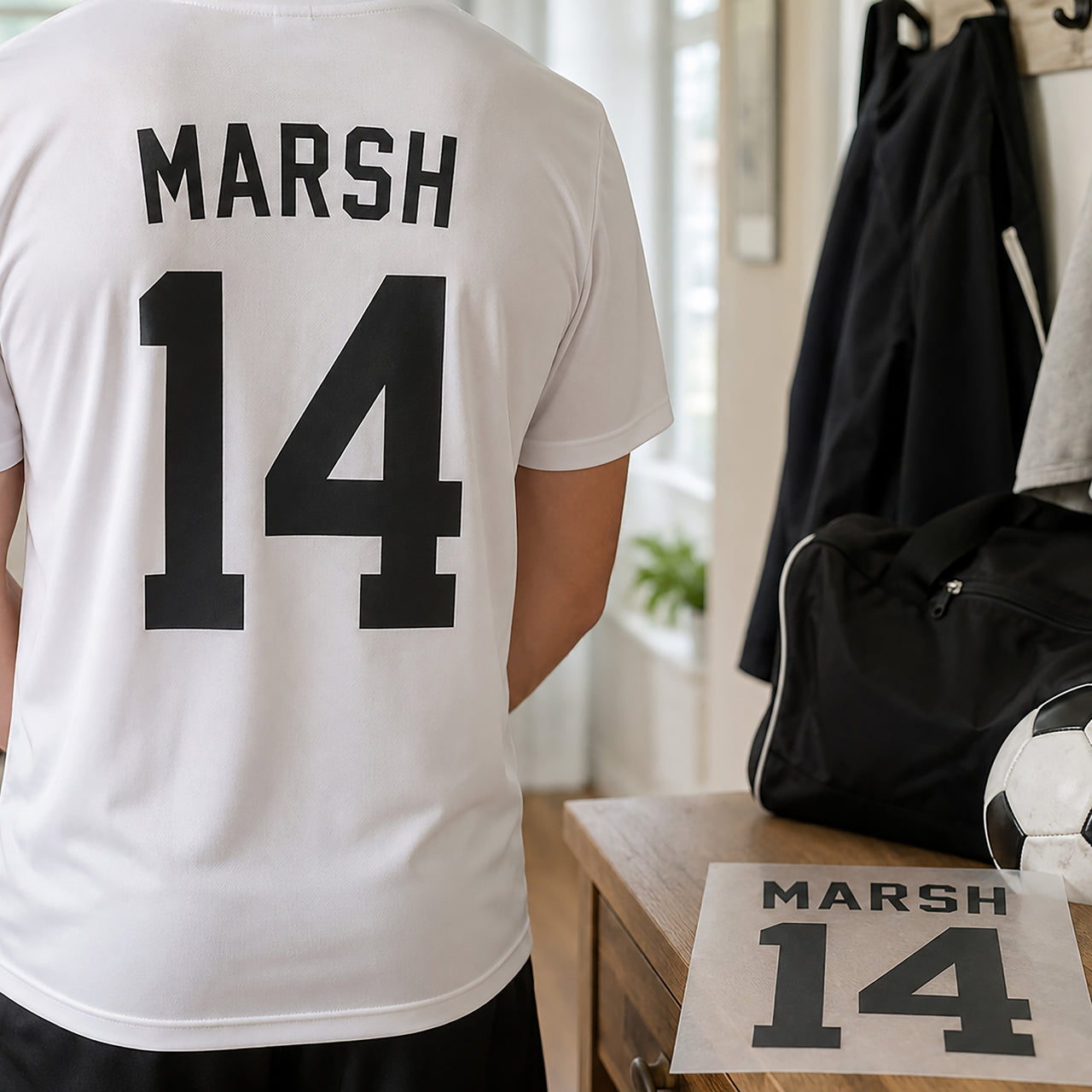 Adult Football Shirt Name Number: black MARSH 14 on the back of a white shirt, with the transfer sheet beside it
