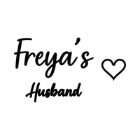 Flat black design with script 'Freya's', smaller 'Husband' below and an outline heart