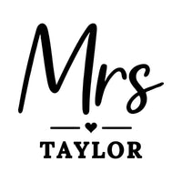 Personalised 'Mrs' 'TAYLOR' iron-on transfer artwork in black on white, script Mrs with a small heart divider
