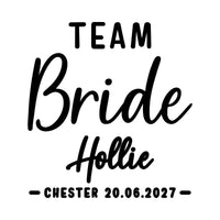 Flat black design on white: 'TEAM' capitals, 'Bride' and 'Hollie' script, 'CHESTER 20.06.2027', hen party iron-on transfer
