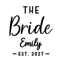 Flat artwork reading 'THE Bride', 'Emily' and 'EST. 2027' in script and capitals, iron-on transfer design