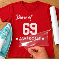 Years Of Awesome iron-on transfer: white Years of 69 AWESOME with stars on a red T-shirt, film being peeled