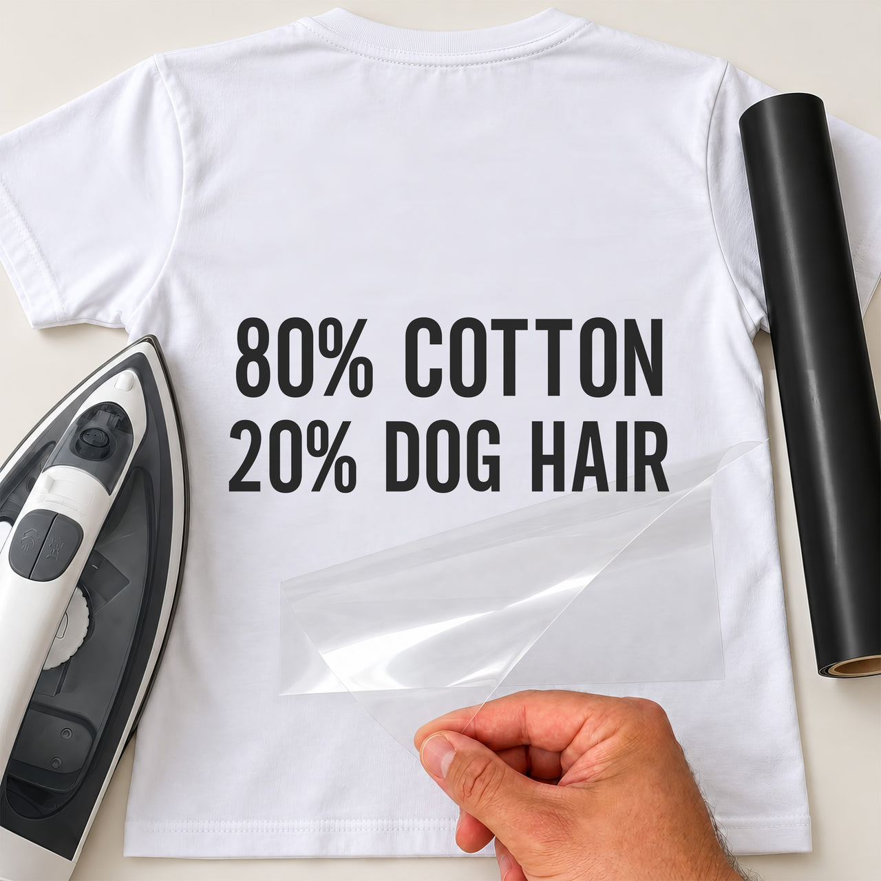 80% Cotton 20% Dog Hair iron-on transfer on a white t-shirt with iron and carrier film