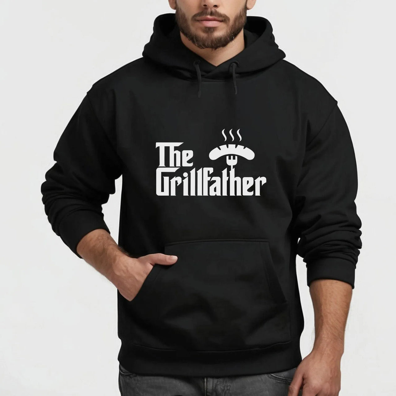 Man wearing black "Grillfather" motif hoodie for BBQ enthusiasts and barbecue masters