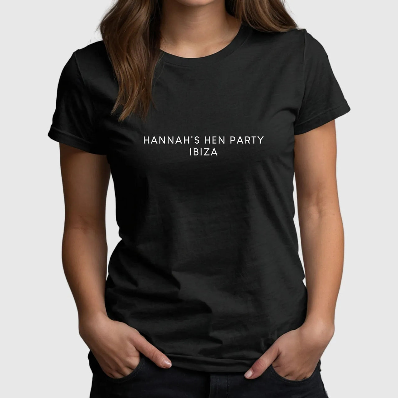 Woman wearing customisable Hen Party T-Shirt for Ibiza celebration with "Hannah's Hen Party Ibiza" text