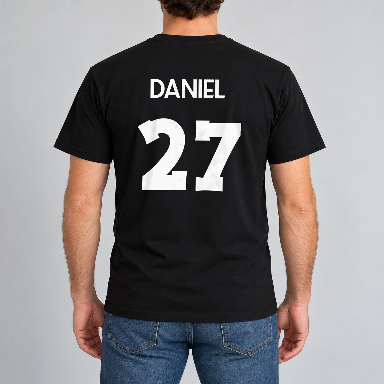 Adult Football Shirt Name Number Iron-On Transfer, shown on a black t-shirt (back view)