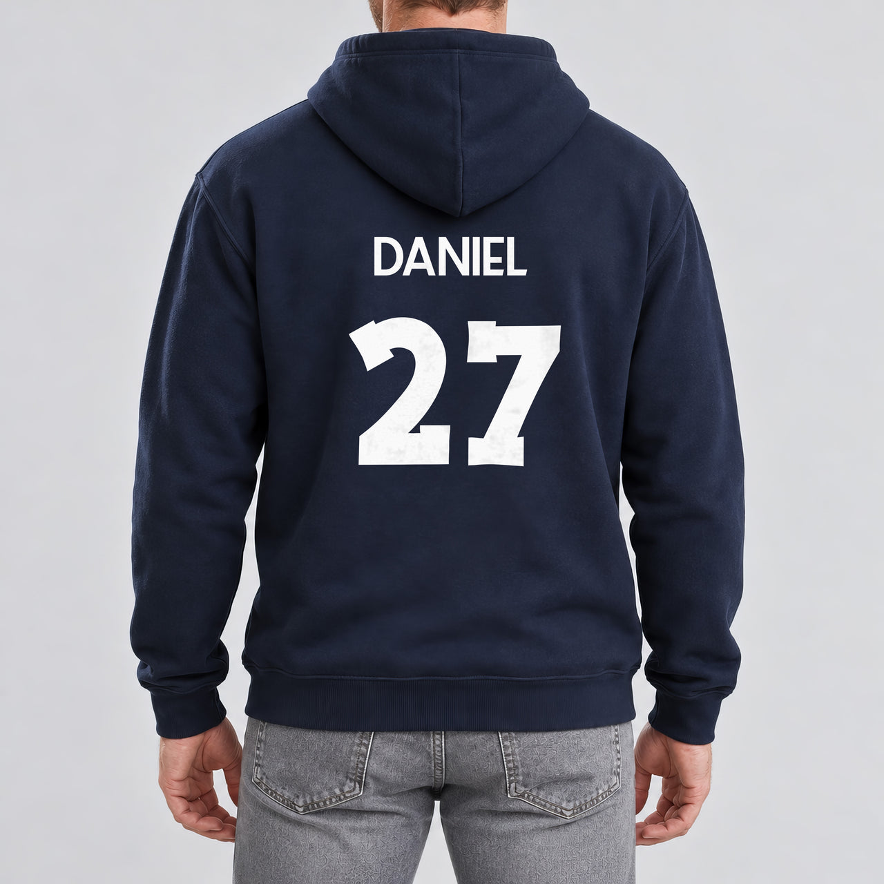 Adult Football Shirt Name Number Iron-On Transfer, shown on a navy hoodie (back view)