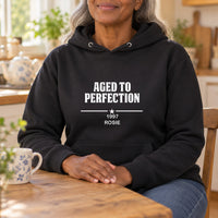 Aged To Perfection Iron-On Transfer, shown on a black hoodie