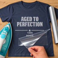 Navy T-shirt mockup with silver 'AGED TO PERFECTION', star divider, '1999' and 'ROSIE' as iron-on vinyl transfer