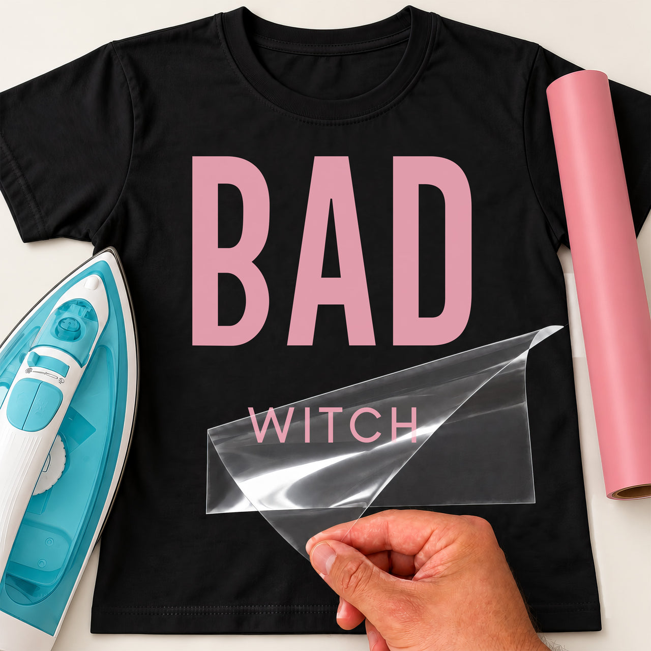Black T-shirt with large pink BAD and smaller WITCH lettering, transfer film peeled by hand