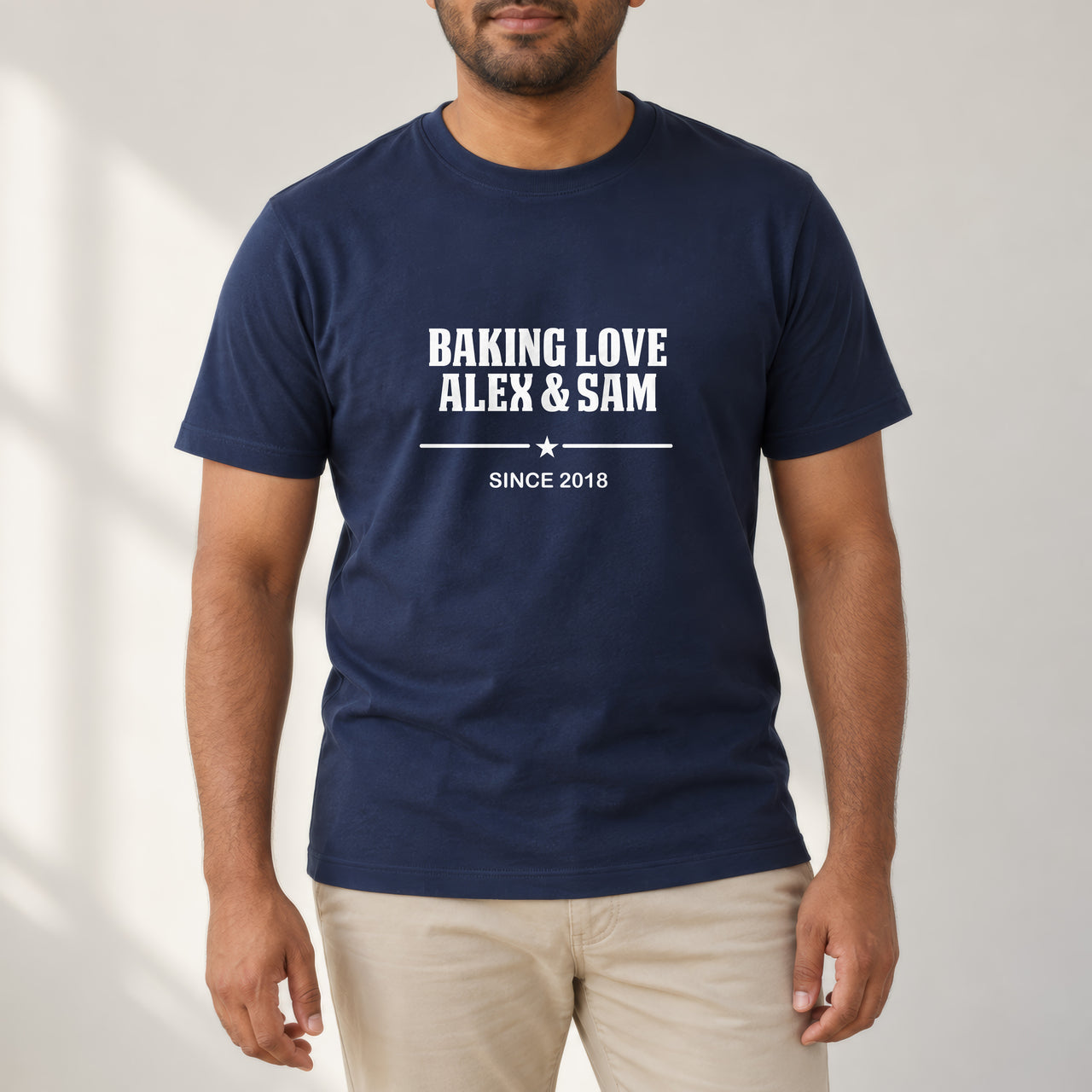 Baking Love Iron-On Transfer - Personalised Couple Names & Year Design, shown on a navy t-shirt