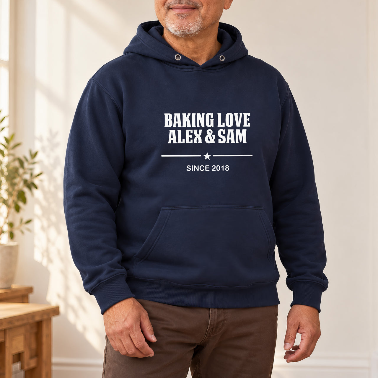 Baking Love Iron-On Transfer - Personalised Couple Names & Year Design, shown on a navy hoodie