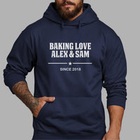 Baking Love Iron-On Transfer - Personalised Couple Names & Year Design shown on a hoodie