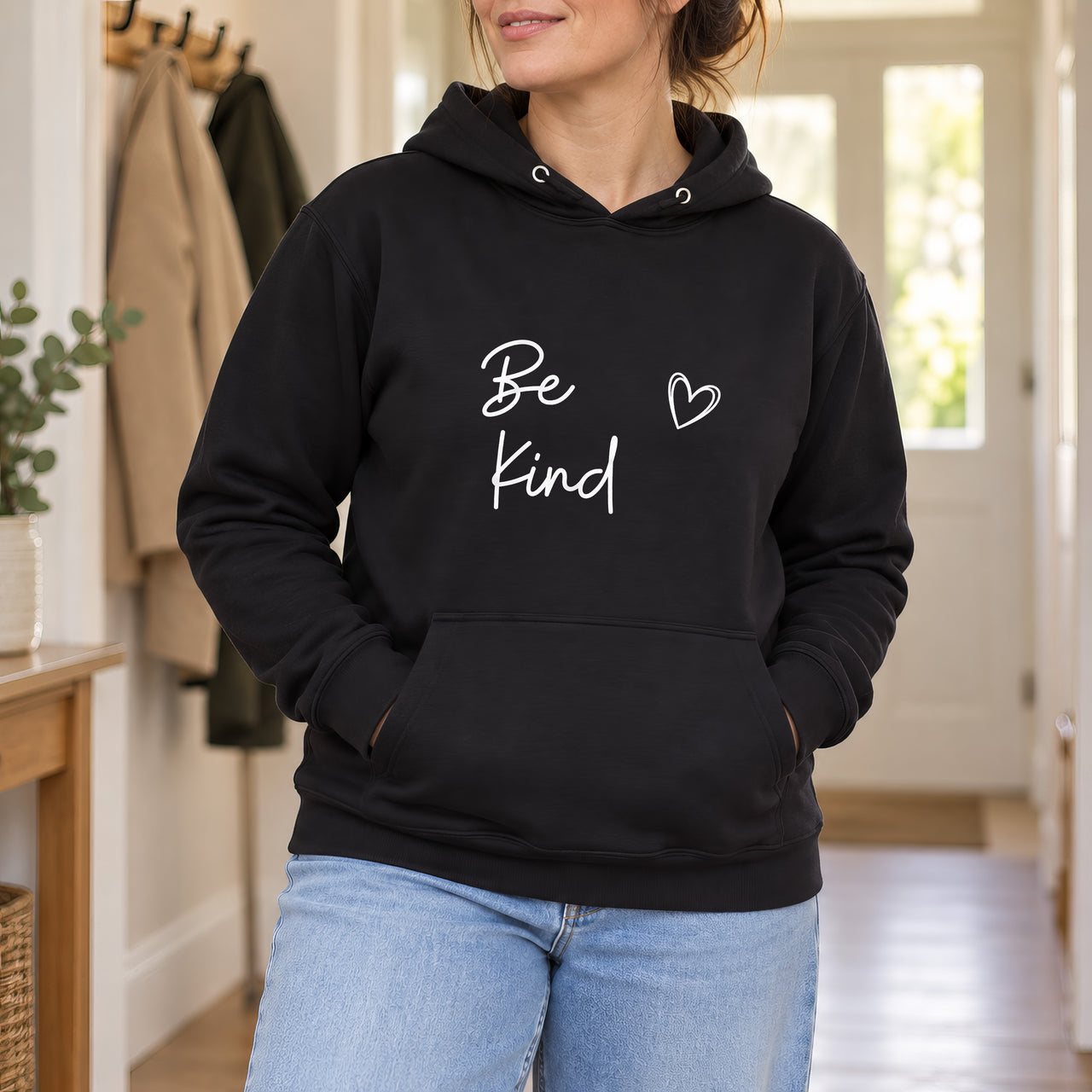 Black hoodie with the Be Kind Script Heart design printed on the chest