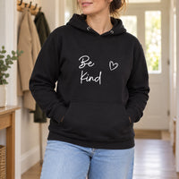 Black hoodie with the Be Kind Script Heart design printed on the chest