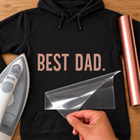 Black hoodie with rose gold 'BEST DAD.' bold capitals iron-on transfer, iron and rose gold vinyl roll