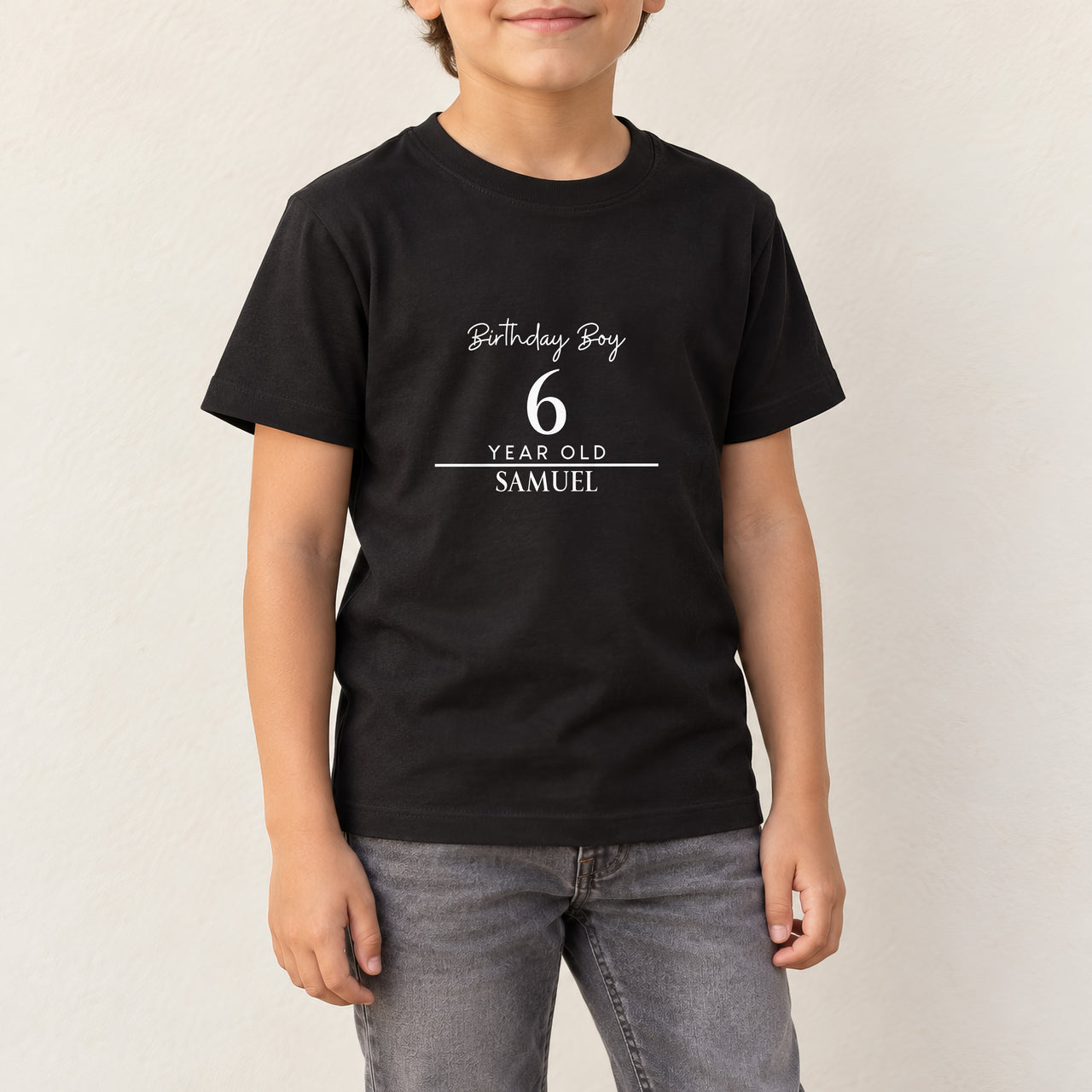 Birthday Boy Age and Name Iron-On Transfer - Personalised, shown on a black kids t-shirt