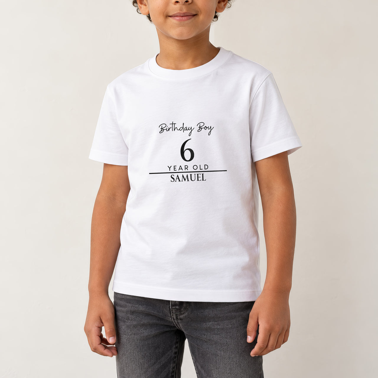 Birthday Boy Age and Name Iron-On Transfer - Personalised, shown on a white kids t-shirt