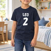 Birthday Number and Name Iron-On Transfer - Personalised, shown on a navy kids t-shirt
