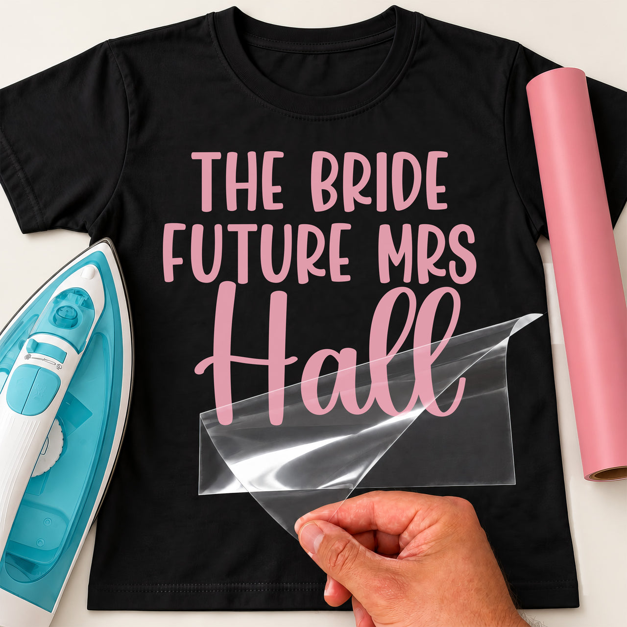 Black T-shirt with pink 'THE BRIDE FUTURE MRS Hall' in capitals and script, bride iron-on vinyl transfer