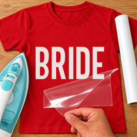 Red T-shirt with 'BRIDE' in white bold capitals, iron and vinyl roll beside, iron-on vinyl transfer