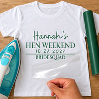 White tee mockup with green iron-on text 'Hannah's Hen Weekend Ibiza 2027' over 'Bride Squad'