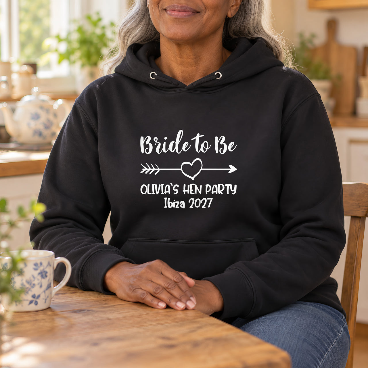 Black hoodie with the Bride to Be Arrow Heart Bold design printed on the chest