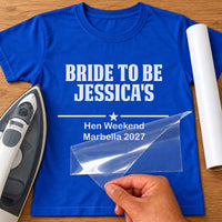 Royal blue T-shirt with white vinyl 'BRIDE TO BE JESSICA'S' and 'Hen Weekend Marbella 2027', mockup with iron