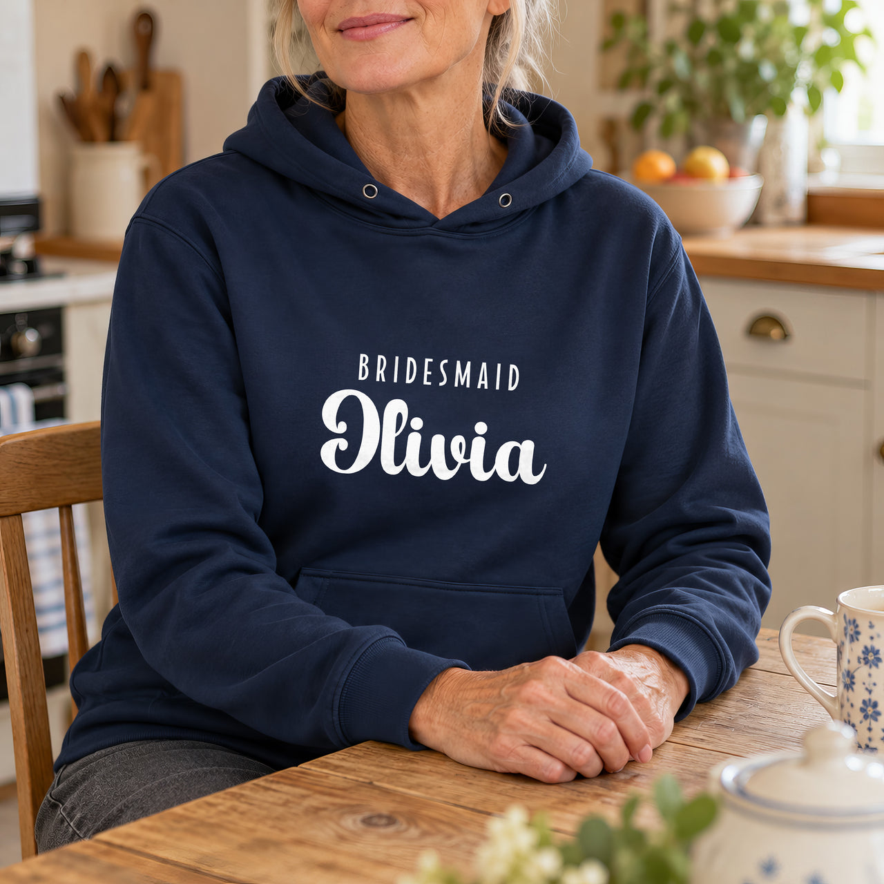 Bridesmaid Name Iron-On Transfer, shown on a navy hoodie