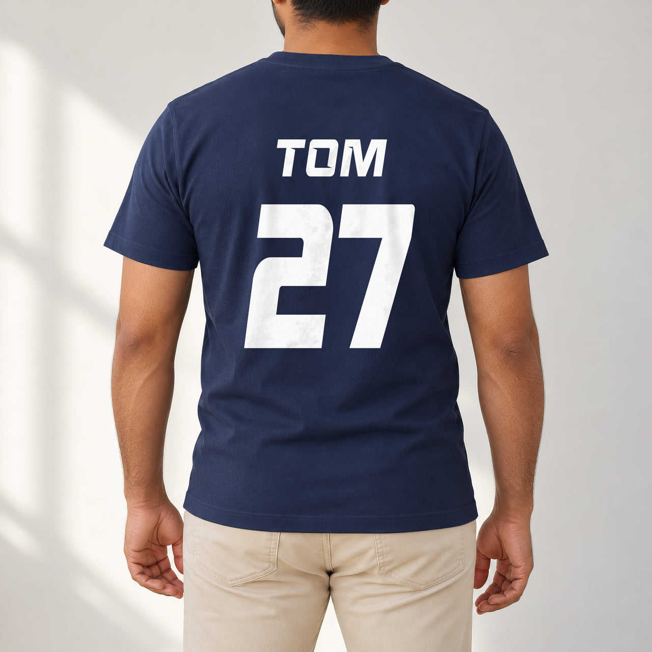 Navy T-shirt with the Charity Match Name and Number design printed on the back