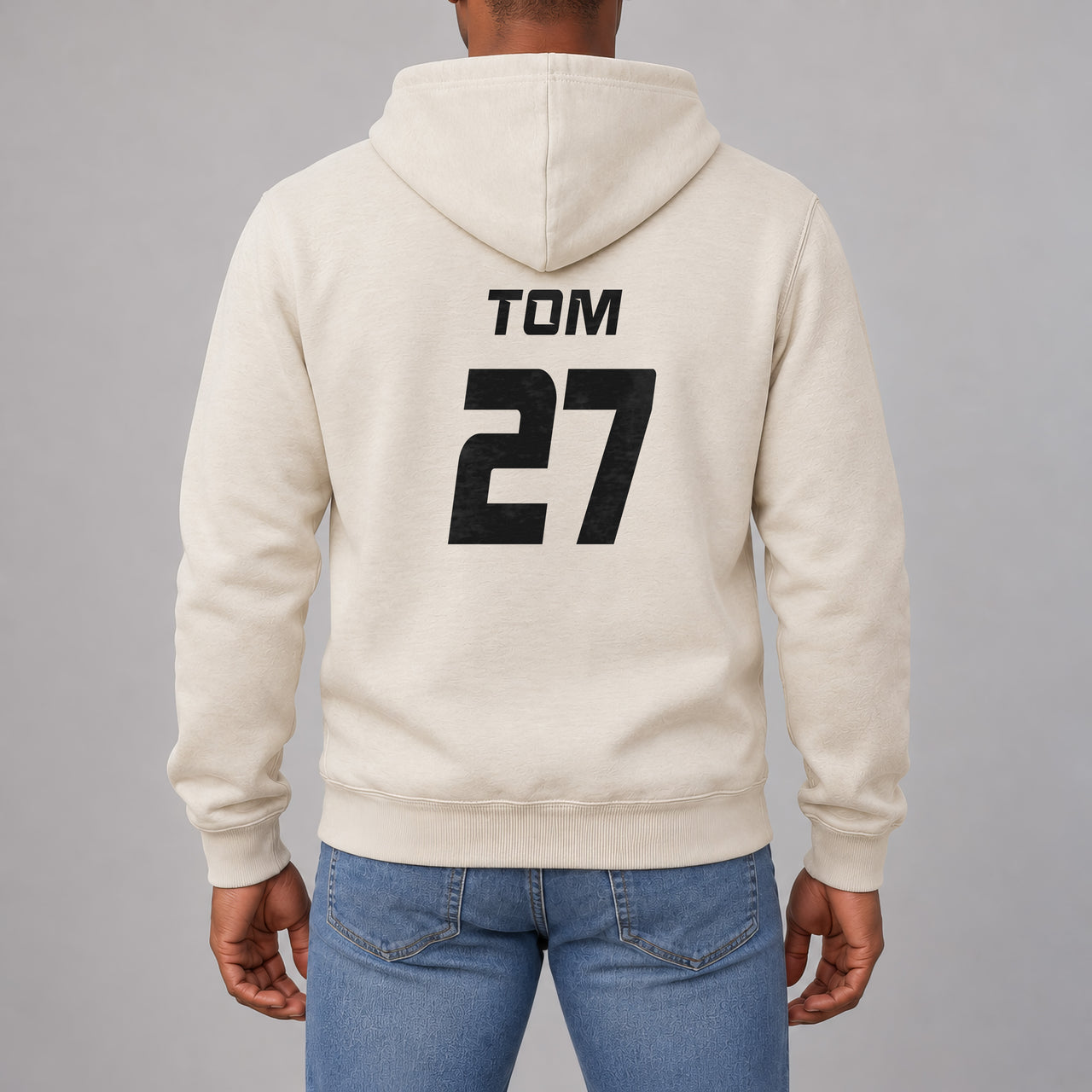 Sand hoodie with the Charity Match Name and Number design printed on the back
