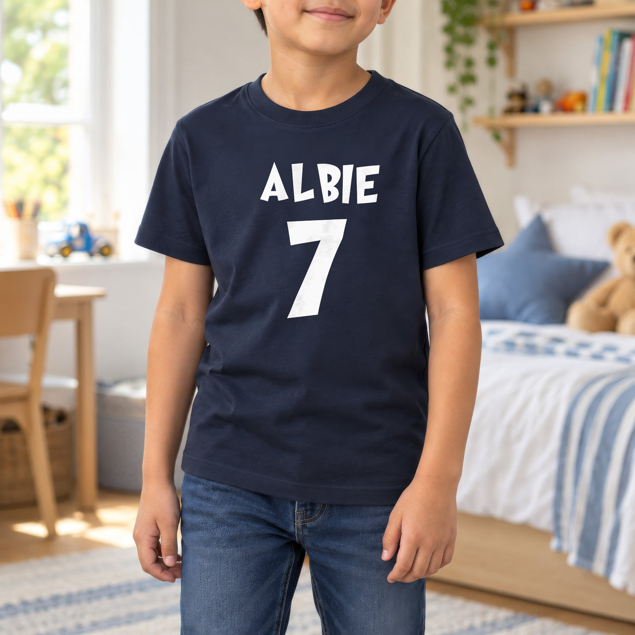 Child's Birthday Name Iron-On Transfer, shown on a navy kids t-shirt