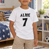 Child's Birthday Name Iron-On Transfer, shown on a white kids t-shirt