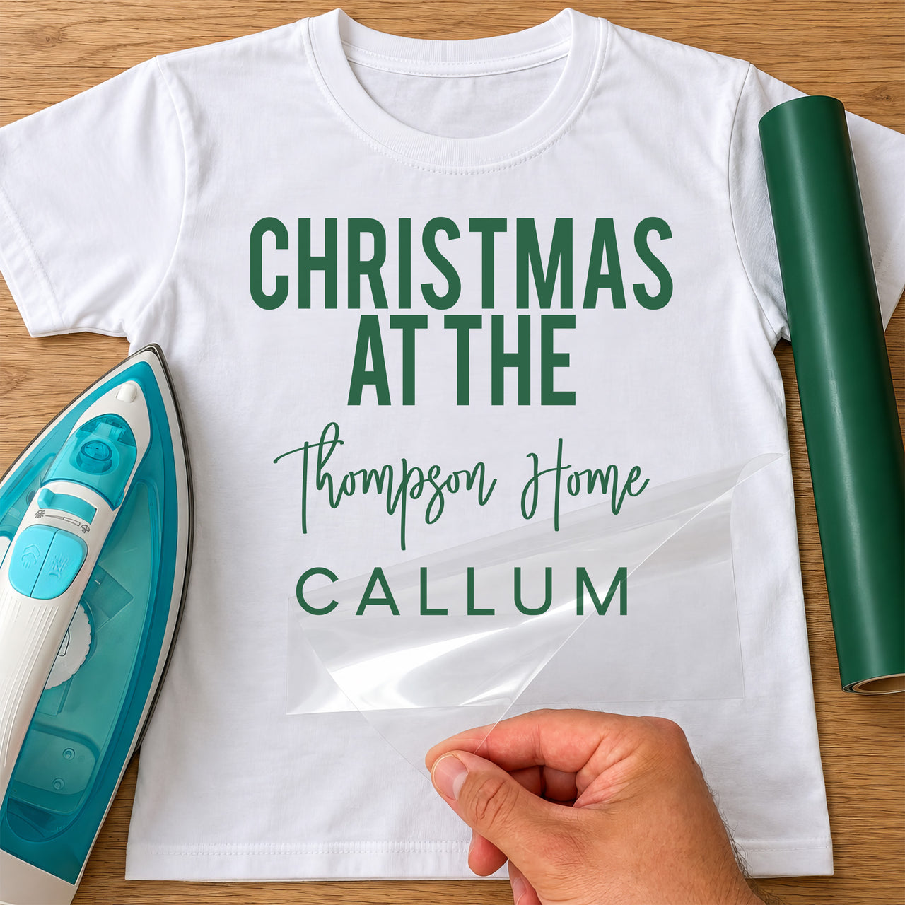 White T-shirt with green "Christmas at the" family name and first name lettering, iron and green vinyl roll
