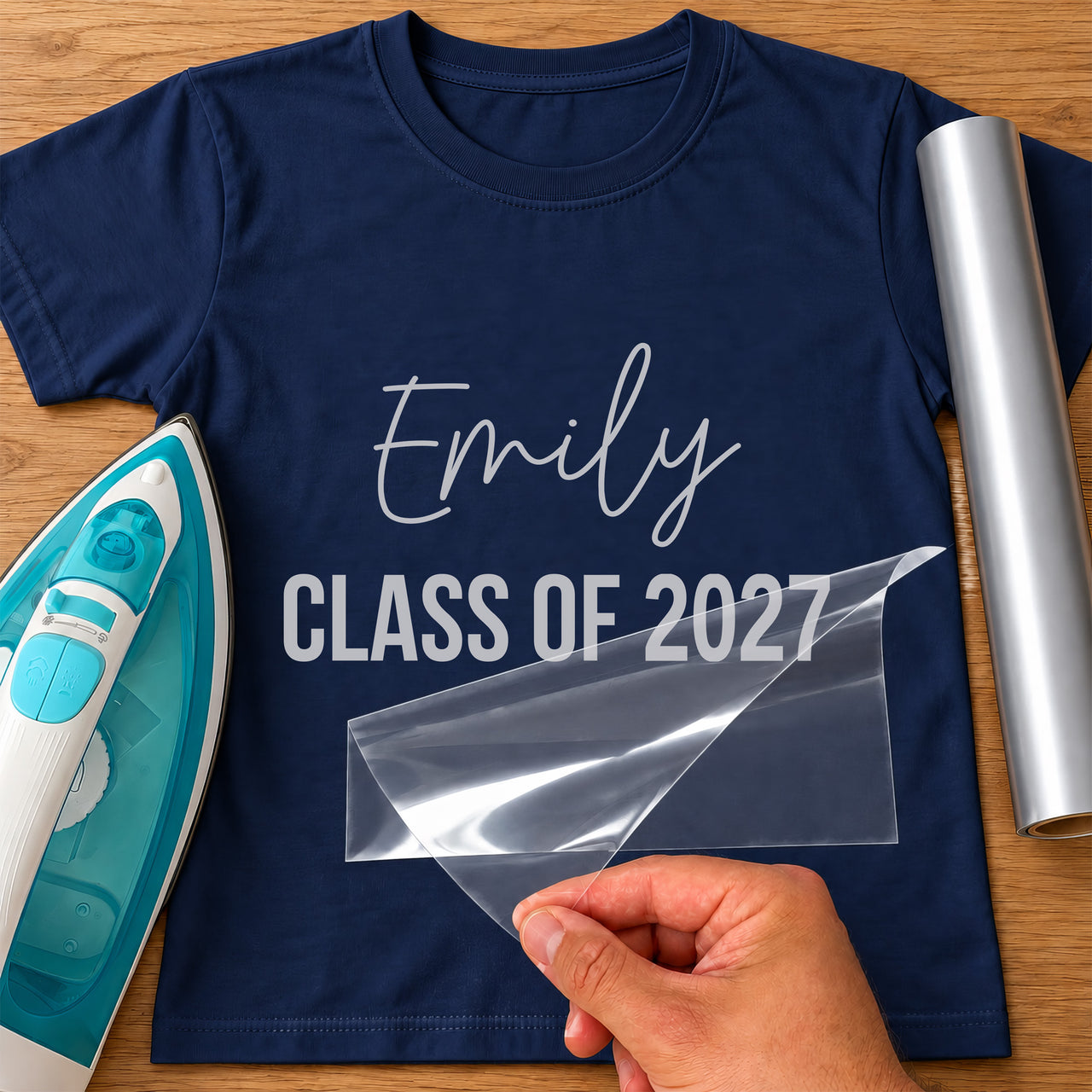 Navy T-shirt with silver 'Emily' script and 'CLASS OF 2027' bold capitals iron-on transfer, iron and silver vinyl roll