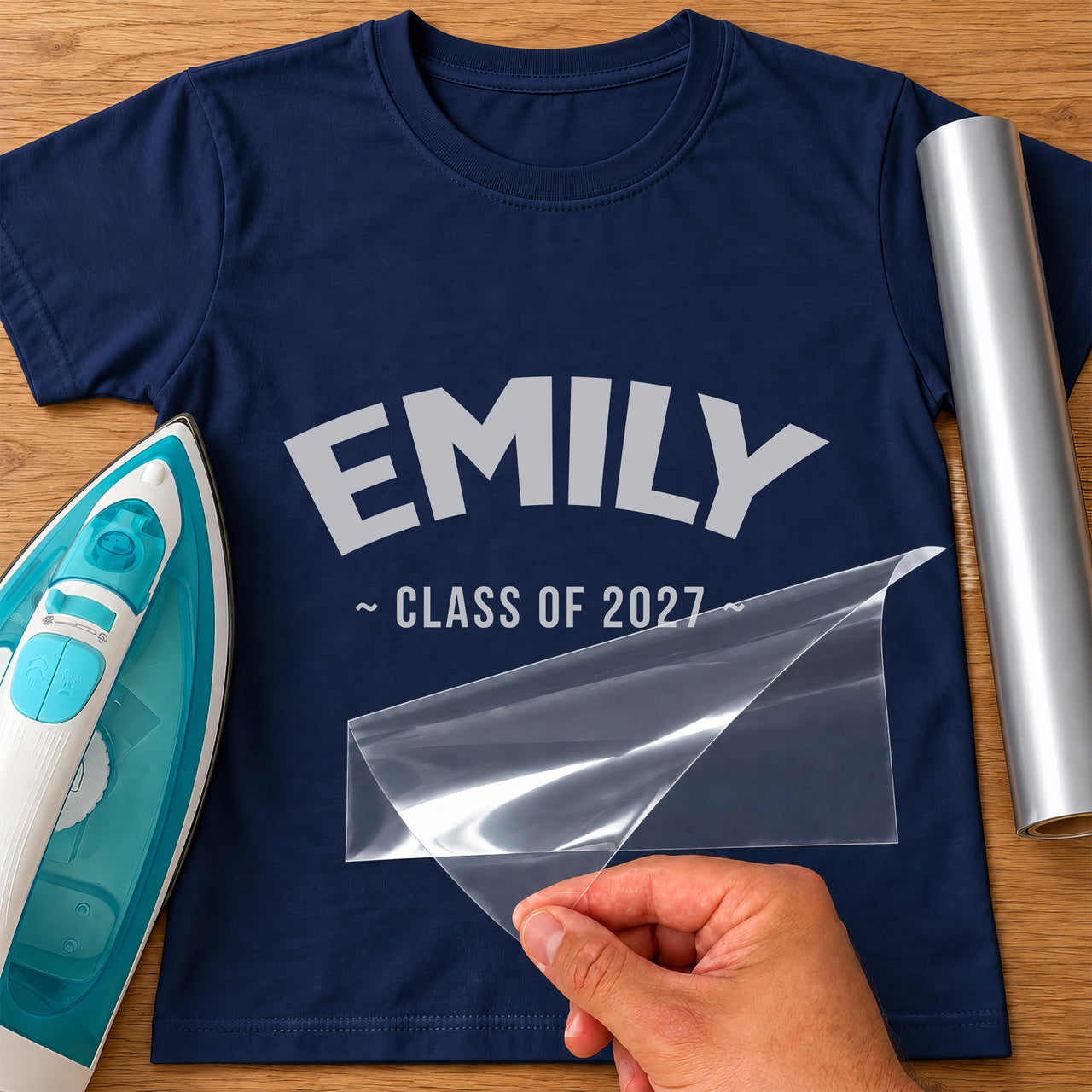 Navy T-shirt with 'EMILY' arched above '~ CLASS OF 2027 ~' in silver, leavers iron-on vinyl transfer