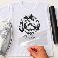 White T-shirt with a black line art dog portrait and the name 'Charlie' in script, custom iron-on vinyl transfer