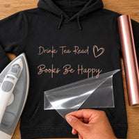 Black hoodie with rose gold iron-on vinyl script 'Drink Tea Read Books Be Happy' and heart