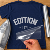 Navy T-shirt with grey arched 'EDITION' and '~ 1971 ~' iron-on transfer, iron and silver vinyl roll