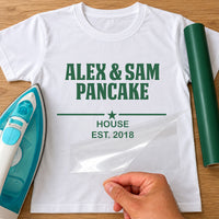 Pancake House iron-on transfer: green ALEX & SAM PANCAKE HOUSE EST. 2018 with a star on a white T-shirt, film being peeled