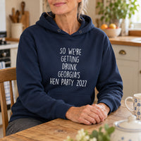 Getting Drunk Hen Do Iron-On Transfer, shown on a navy hoodie