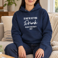 Getting Drunk Hen Party Iron-On Transfer, shown on a navy hoodie