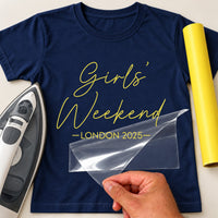 Navy T-shirt with yellow script 'Girls' Weekend' and 'LONDON 2025' iron-on transfer, iron and yellow vinyl roll