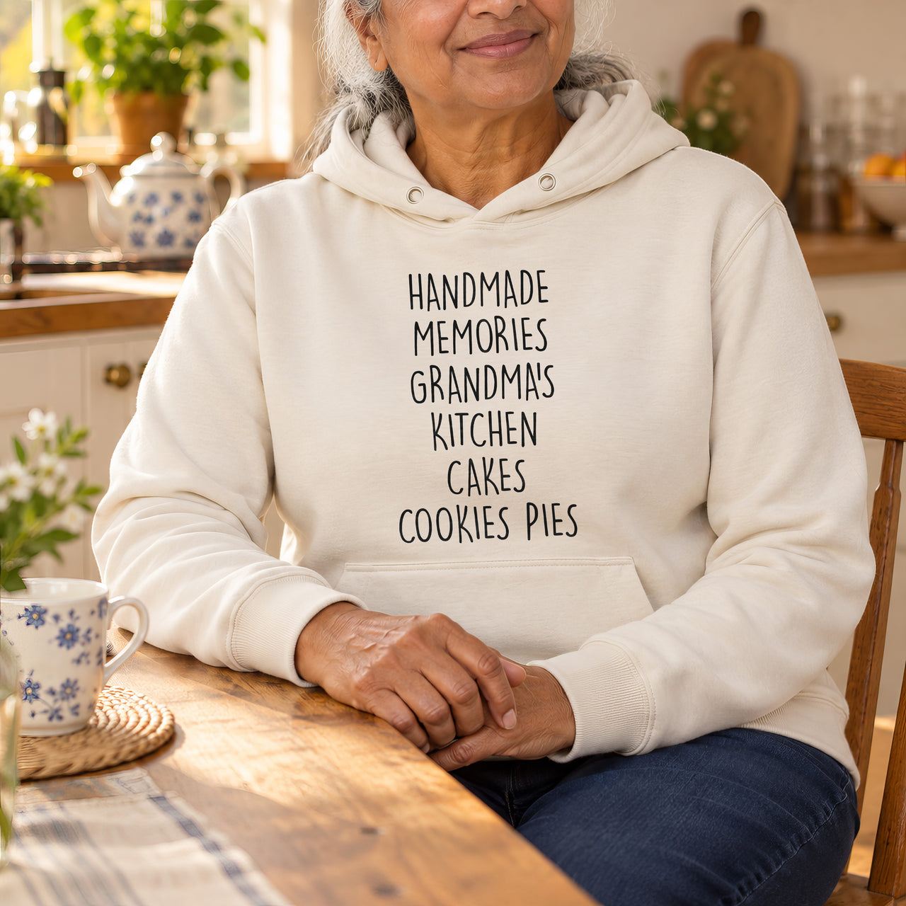 Sand hoodie with the Grandma's Kitchen design printed on the chest