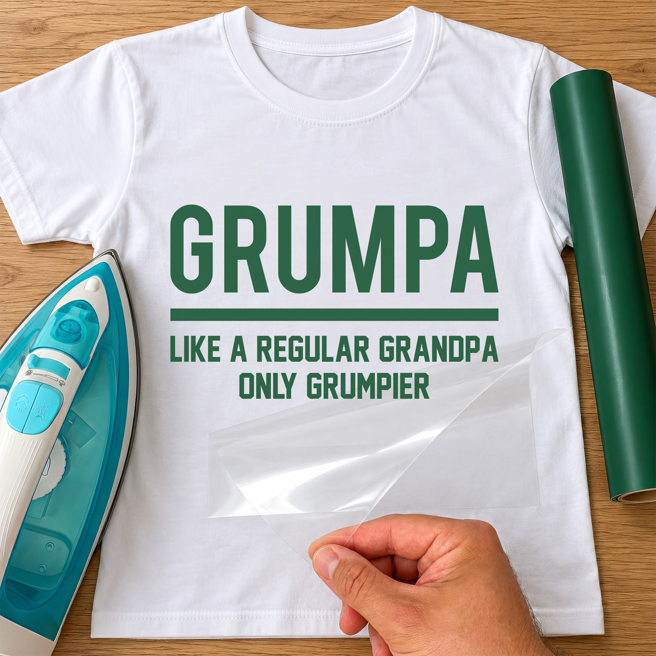 Mockup of a white tee with green "GRUMPA" text, a rule and "LIKE A REGULAR GRANDPA ONLY GRUMPIER", iron on the left