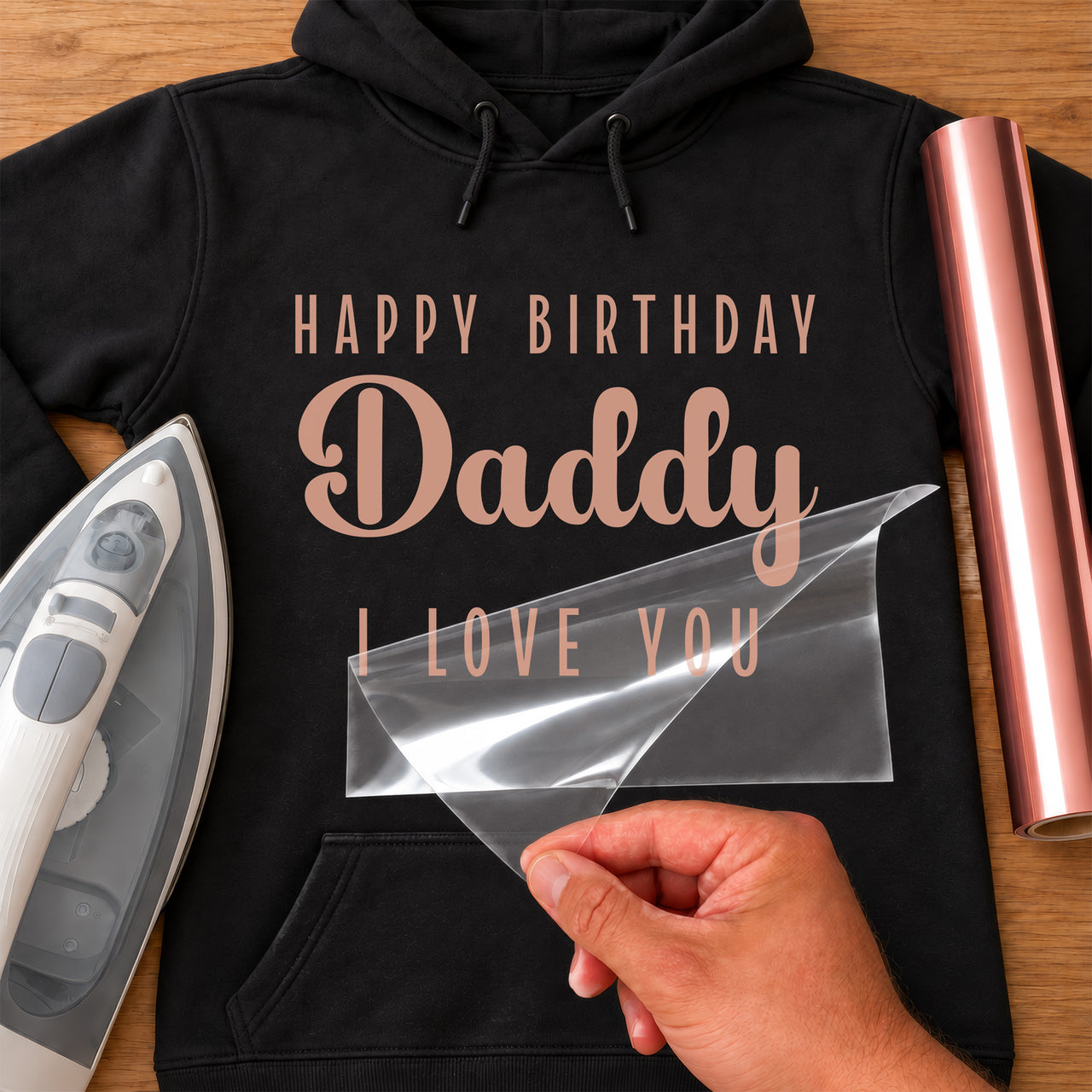 Black hoodie mockup in rose gold: "HAPPY BIRTHDAY", a script "Daddy" and "I LOVE YOU", with iron and vinyl roll