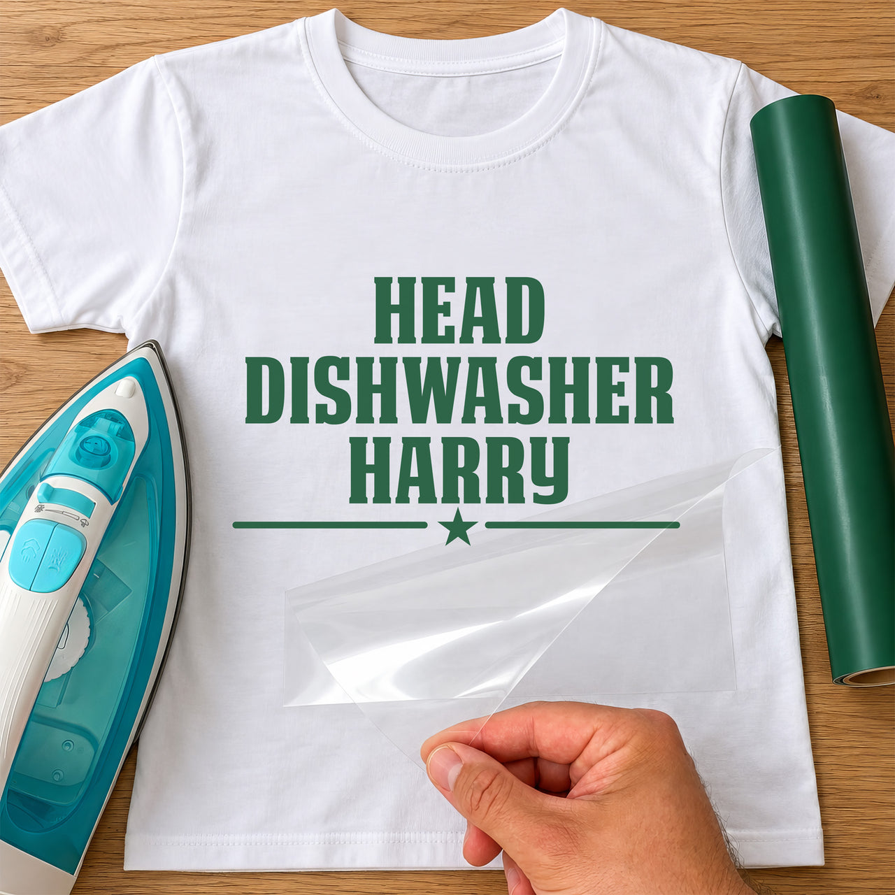 Head Dishwasher name iron-on transfer: green HEAD DISHWASHER HARRY with a star on a white T-shirt, film being peeled